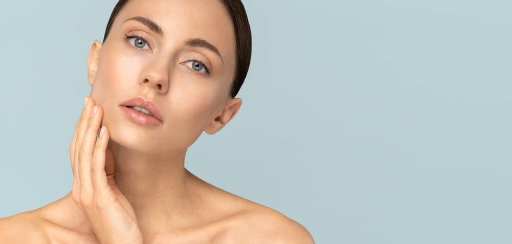 Studio,Portrait,Of,Young,Woman,With,Natural,Makeup,,Combed,Hair,