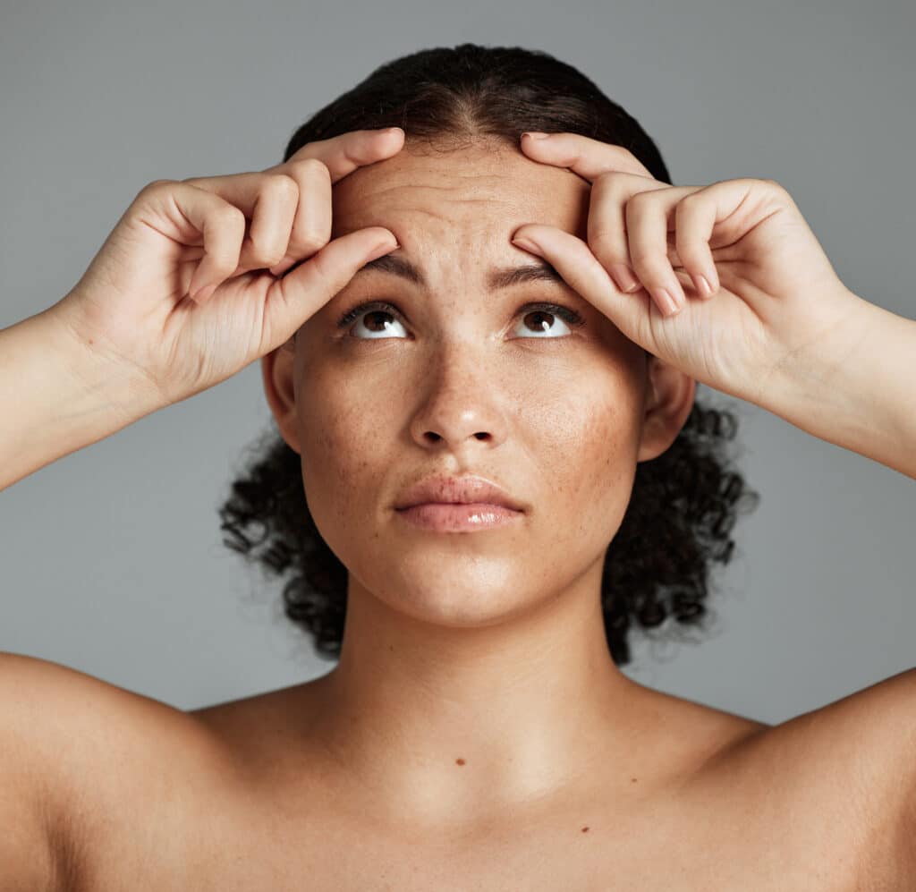 Face wrinkles, beauty health and anxiety of black woman with wellness facial, botox help and prp. Selfcare, woman face and dermatology of a model with plastic surgery aesthetic skin problem check